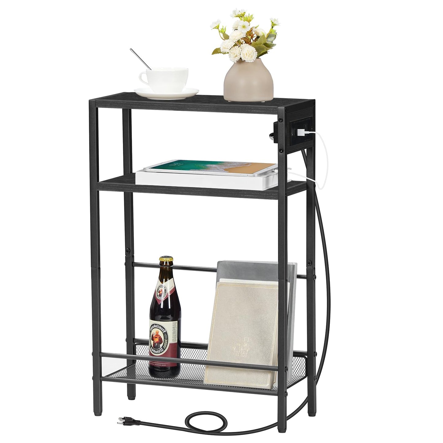 Slim black nightstand with a side embedded power strip holding books and a wine bottle on a white background.