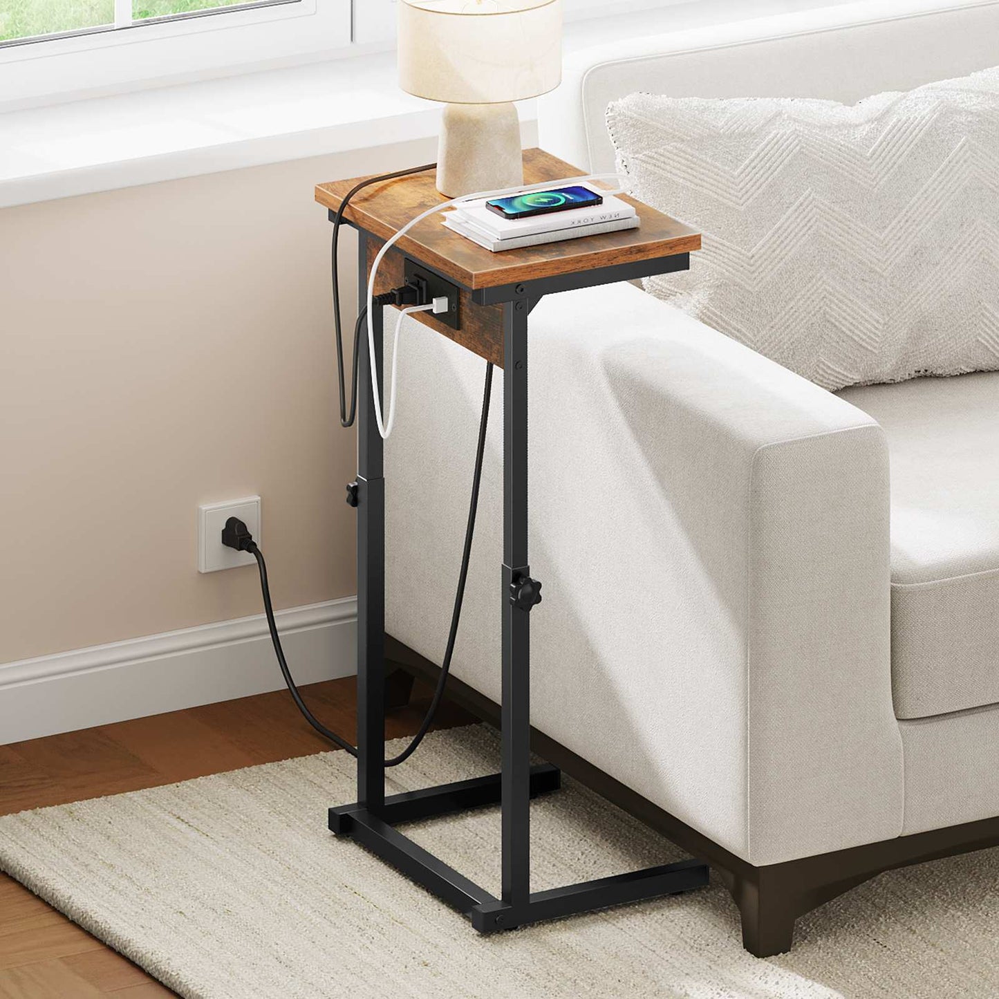Side view of a slim sofa side table with charging ports neatly plugged into a wall outlet behind a couch.