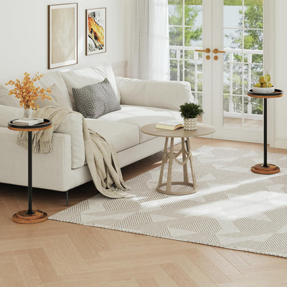 Cozy living room layout showcasing multiple slim tall accent tables styled around a white fabric sofa.