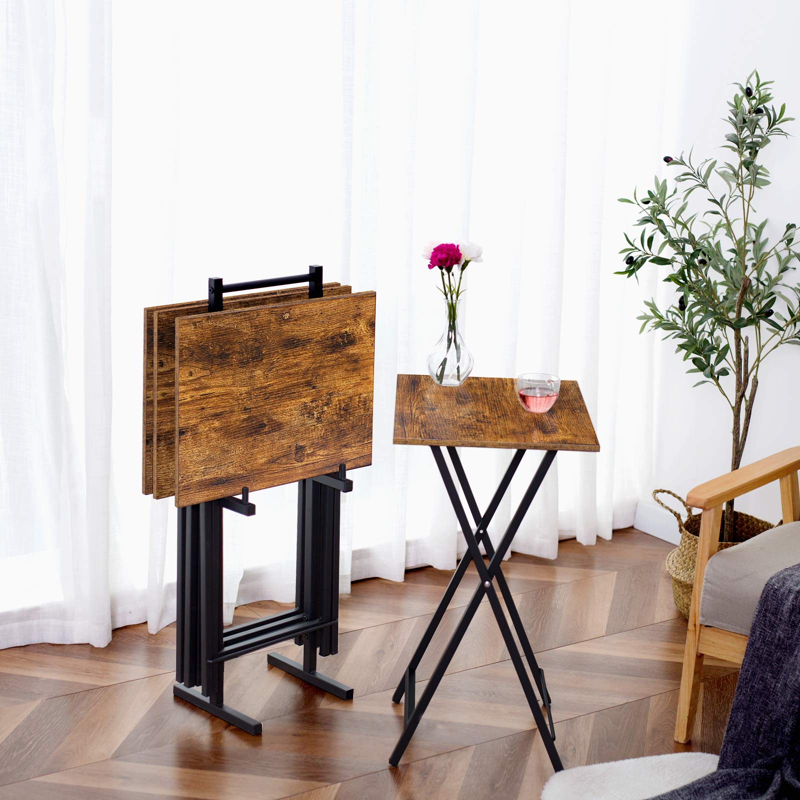 Space-saving folding dinner trays for eating on a couch with a matching vertical storage stand.