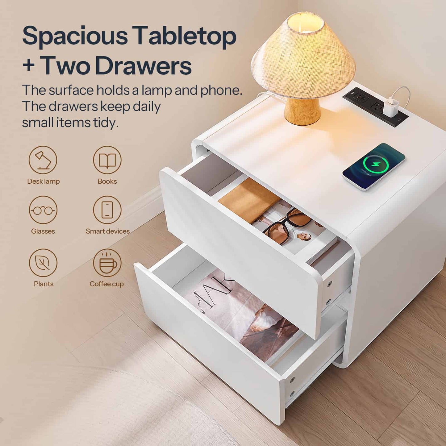 White nightstand with two drawers and a lamp on a wooden floor.