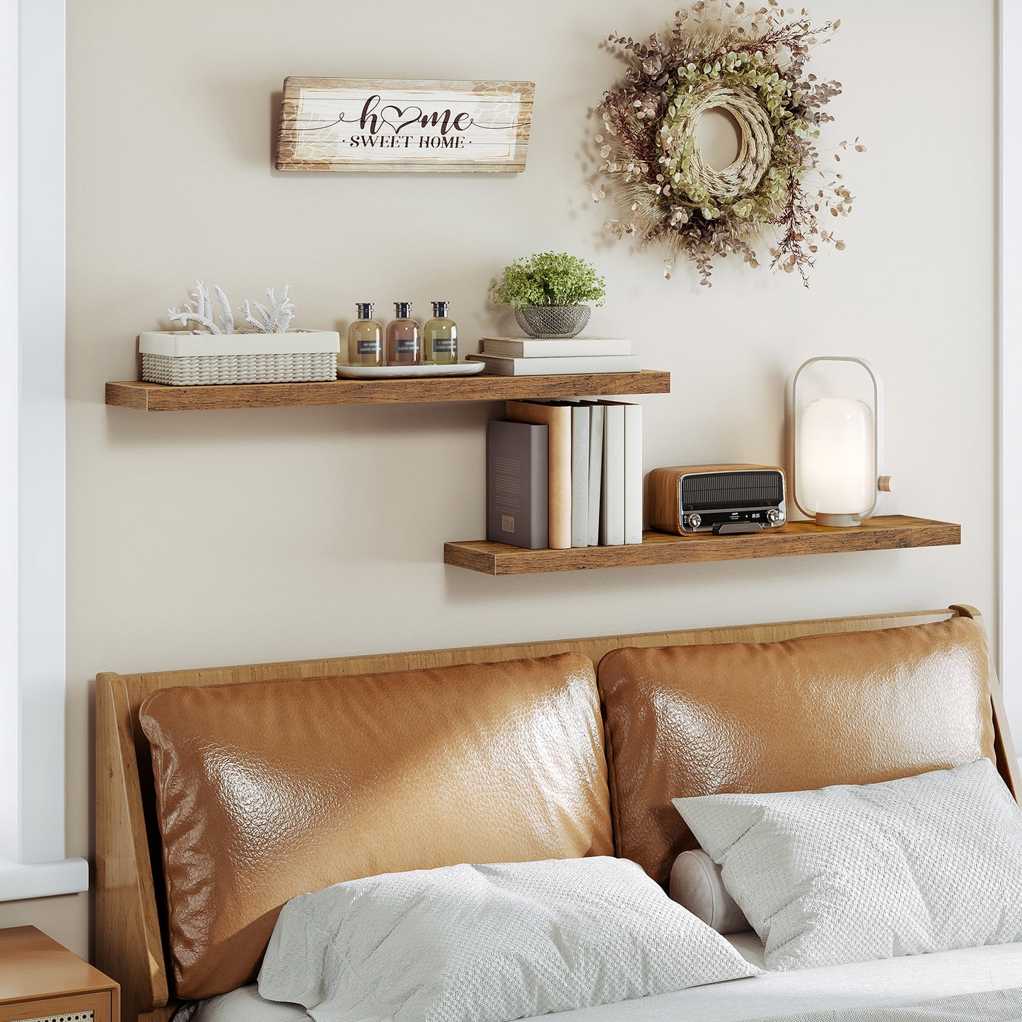 Staggered bedroom floating shelves mounted above a leather headboard for warm decor.