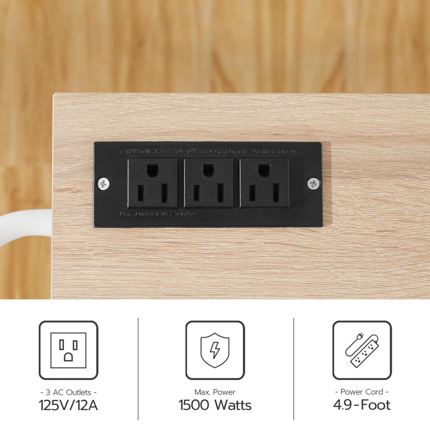 Close up of the embedded tabletop charging station showing 3 AC outlets and a 1500W high power output safety diagram.