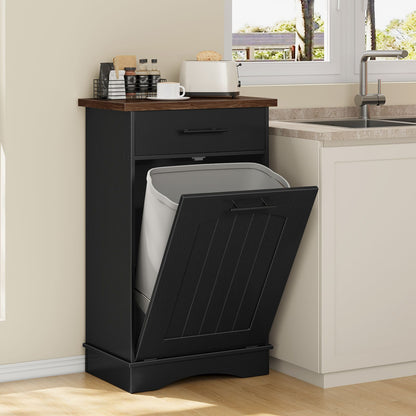 Tilt-out storage cabinet used as a hidden trash recycling station next to a kitchen counter sink.