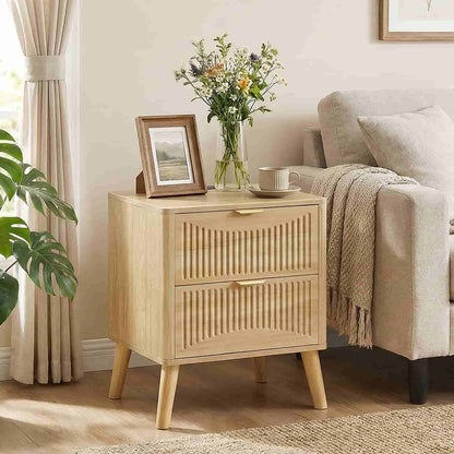 Fluted wood nightstand used as an end table next to a beige sofa in a modern living room setup.