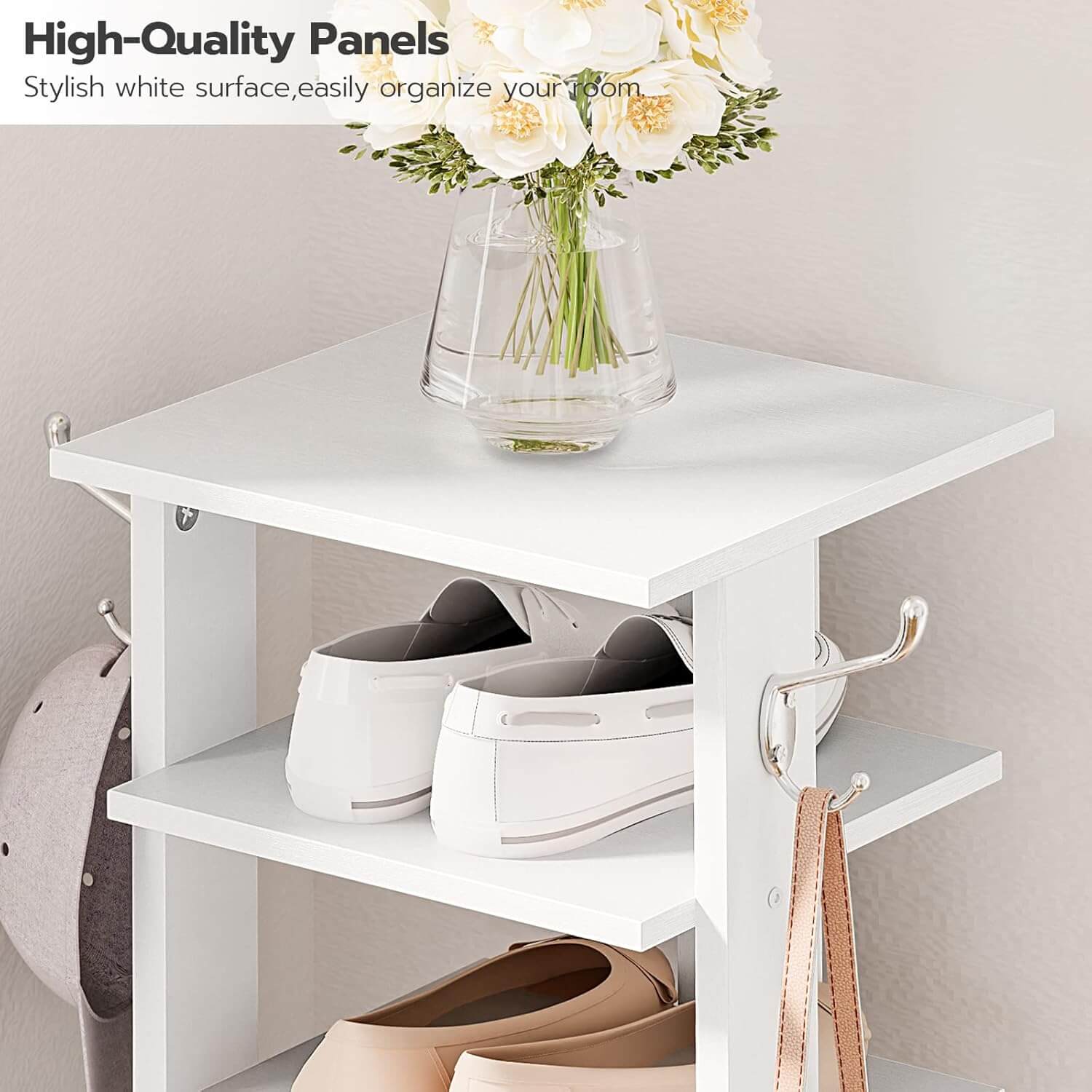 White storage shelf with shoes, a helmet, and a vase of flowers on a neutral background