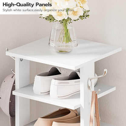White storage shelf with shoes, a helmet, and a vase of flowers on a neutral background