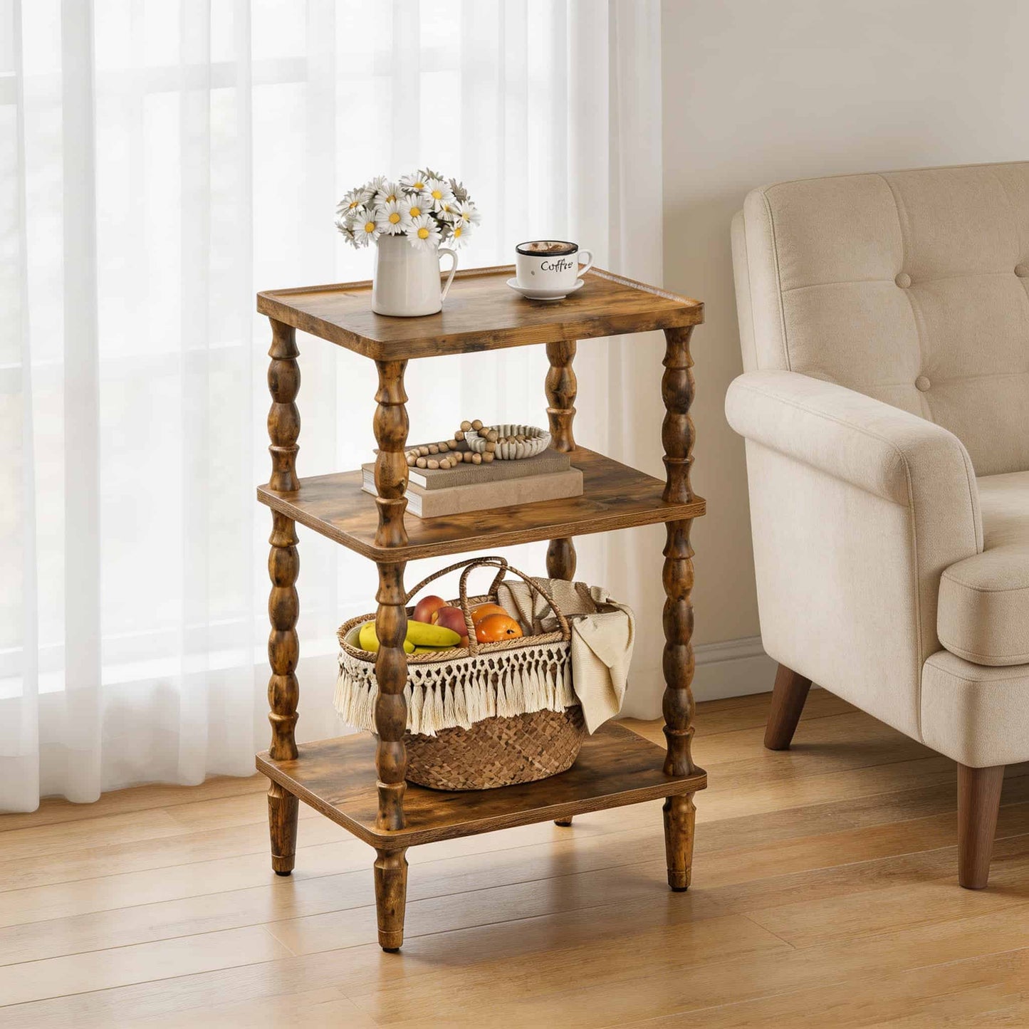 Vintage rustic 3-tier end table with elegant turned legs styled with flowers and coffee next to a cream armchair.