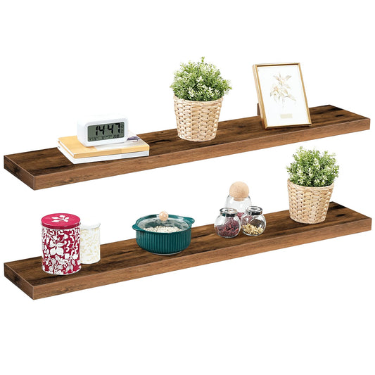 Two pieces of wall-mounted rustic display ledges holding books, small succulent pots, and decorative home ornaments.
