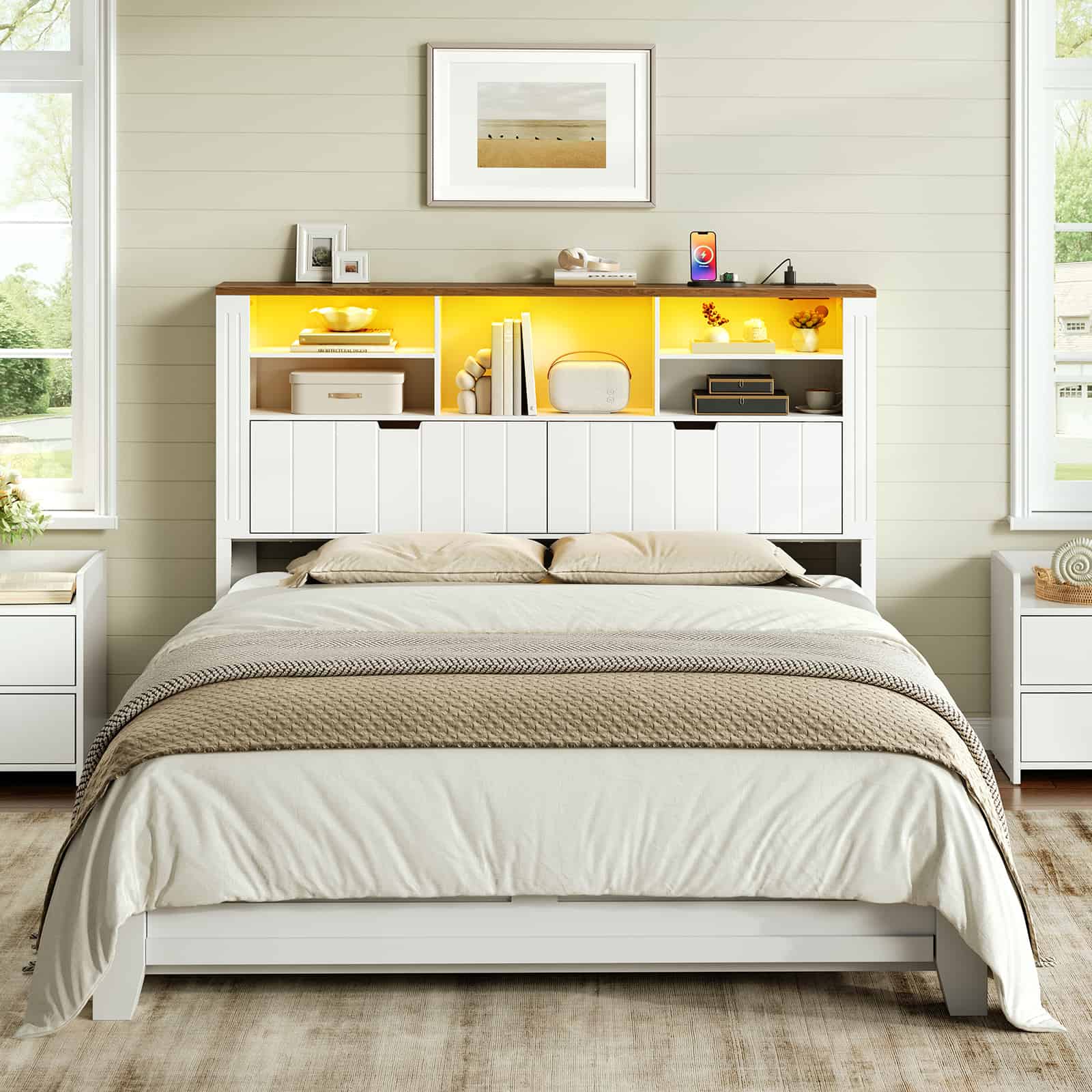 Front view of a white bookcase headboard tower with glowing warm yellow lighting styled in a modern rustic bedroom.