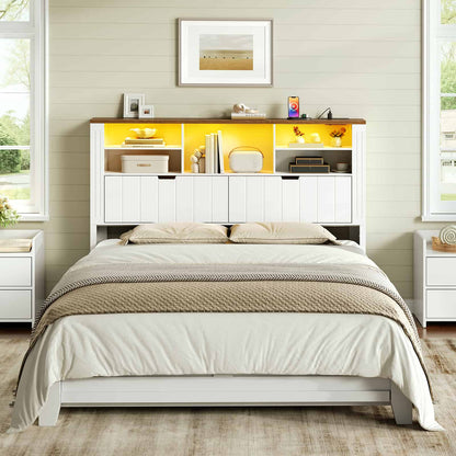 Front view of a white bookcase headboard tower with glowing warm yellow lighting styled in a modern rustic bedroom.