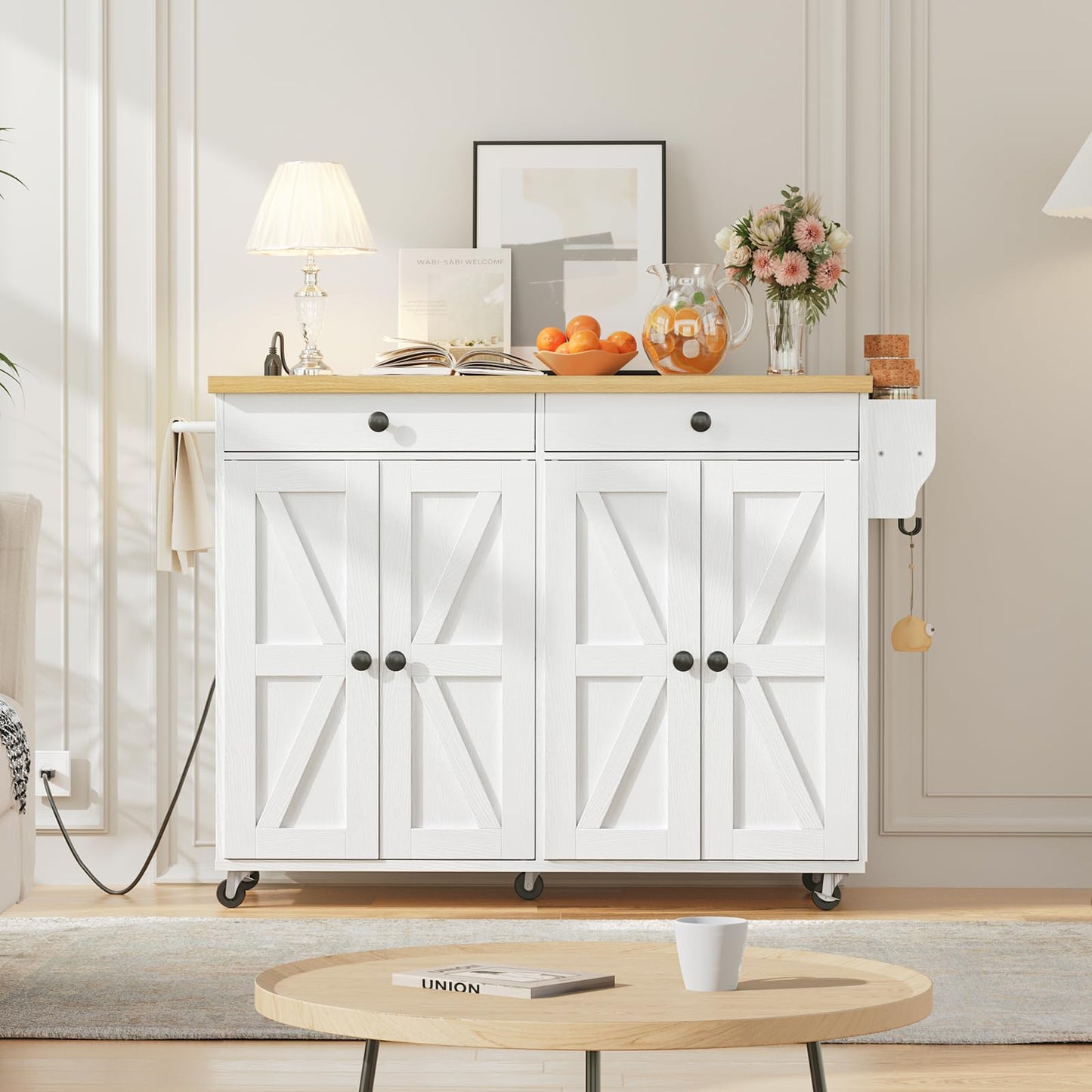 White farmhouse kitchen sideboard cabinet used as an elegant accent display station against a living room wall.