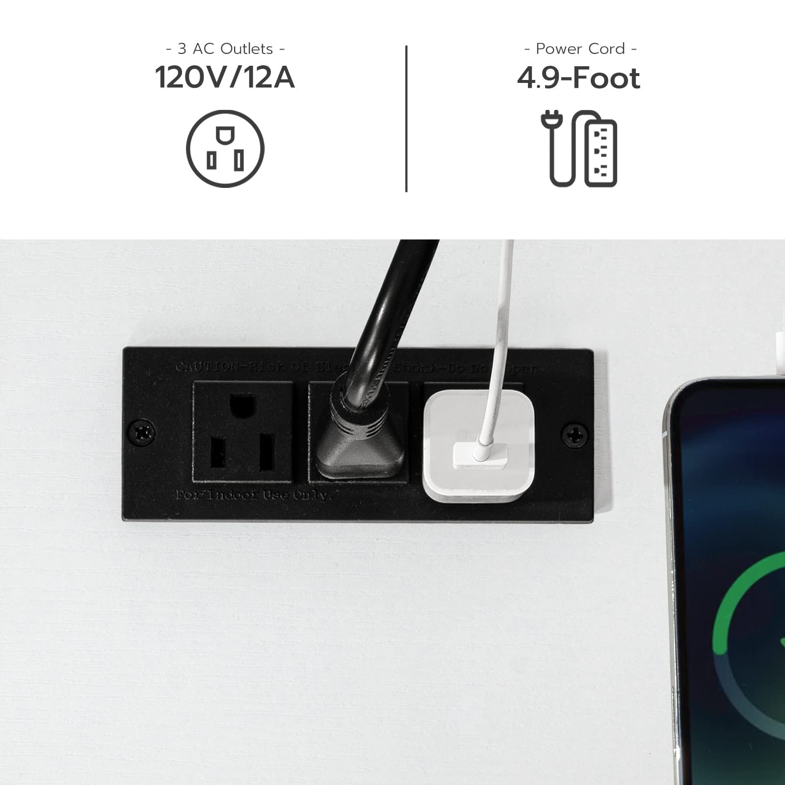 Black power outlet with a cord plugged in, next to a smartphone on a white background.