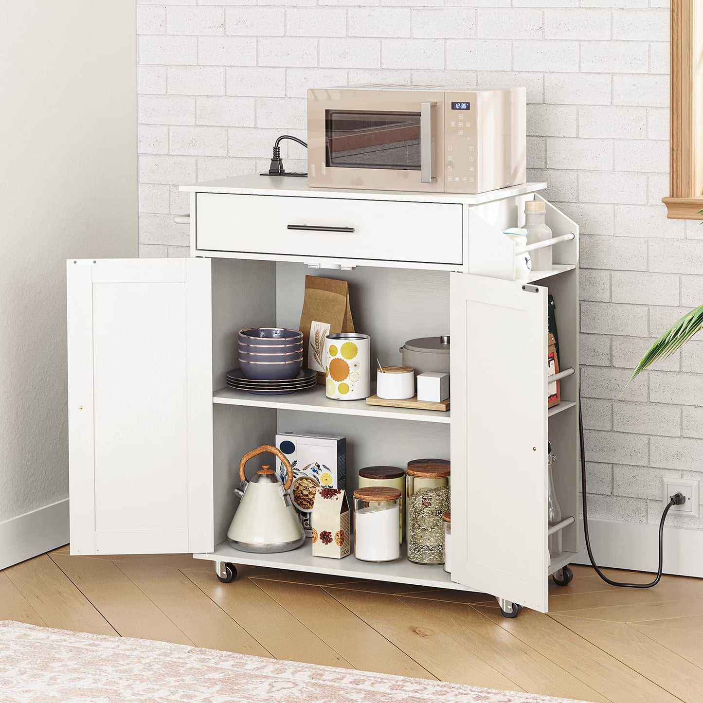 White kitchen cart with microwave and storage shelves in a kitchen setting.