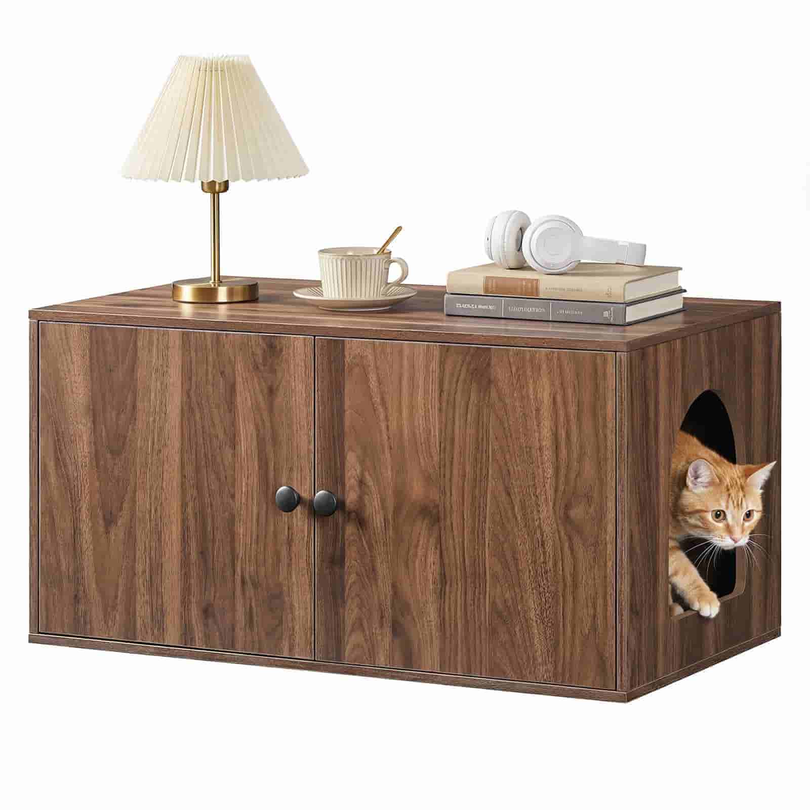 Closed wooden cat house with a table lamp on top, showing a cat peeking out from the arched side entrance.